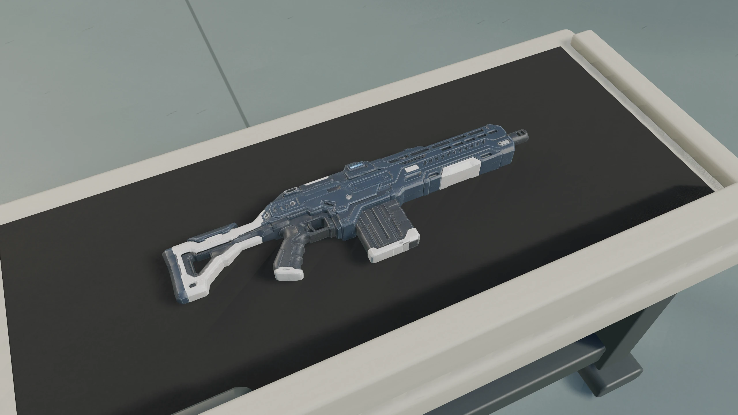 Blue-gray and white P-84 Vigil service rifle resting on a dark workbench, captured in-engine.